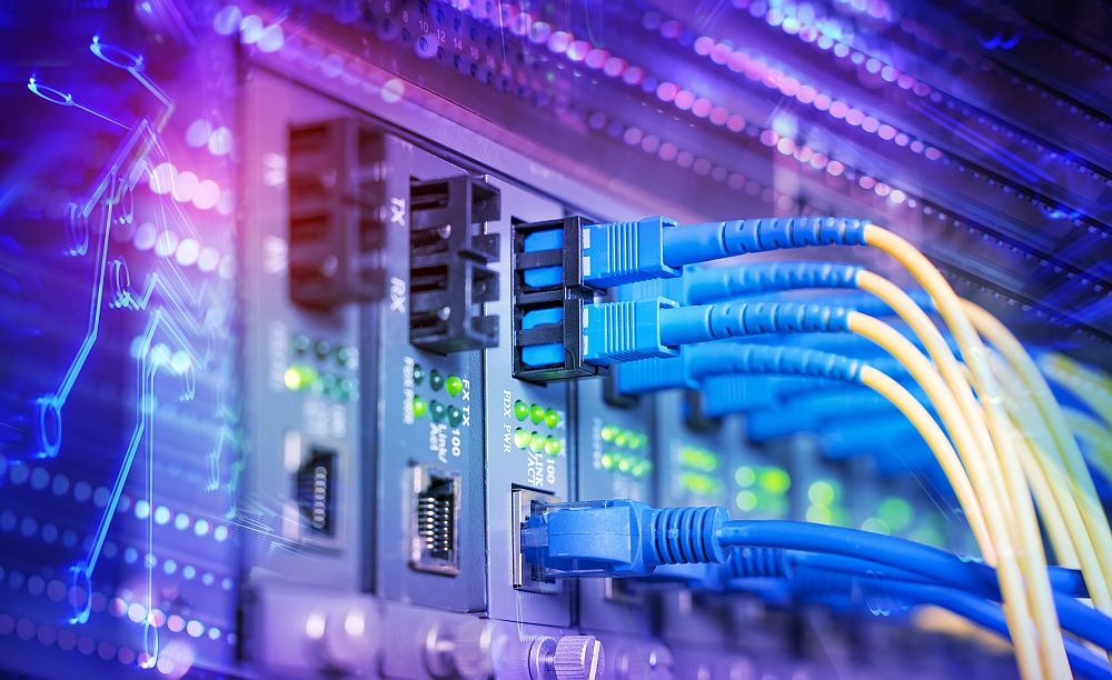 Fiber Optic cables connected to optic ports and UTP, Network cables connected to ethernet ports.