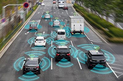 Cars and trucks on motorway, with wireless communication network pictograms