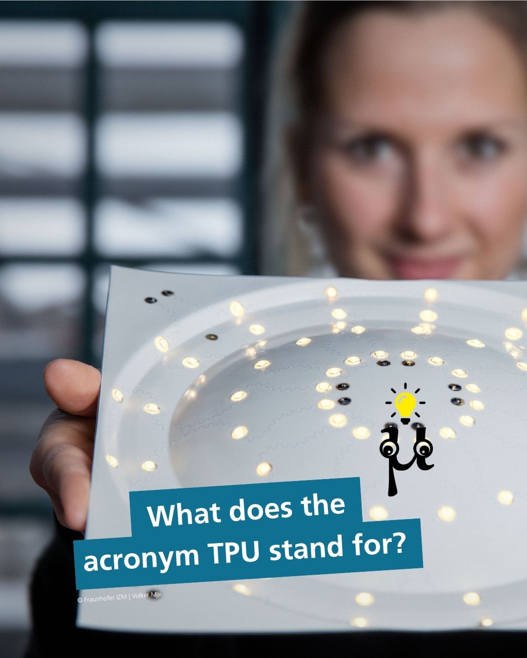 Person holding a square plate featuring circularly arranged glowing LEDs